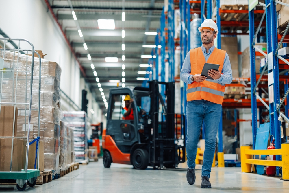 Man in front of forklift