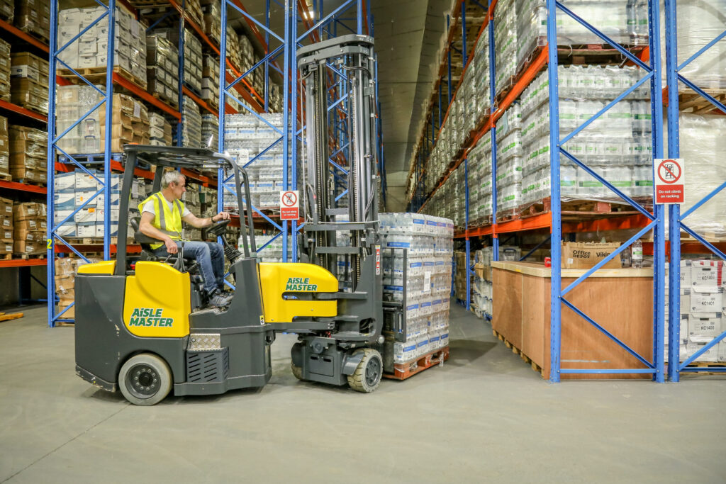 Combilift-Aisle-Master-Articulated-Narrow-Aisle-Food-and-Drink-Water-Pallets-scaled-1.jpg